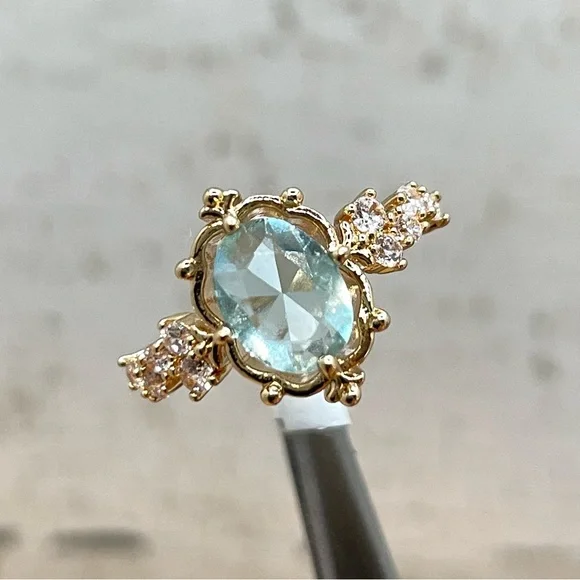 Beautiful Dainty Vintage Look Oval Cut Blue Aquamarine Diamond CZ Gold Tone Ring - Picture 1 of 6